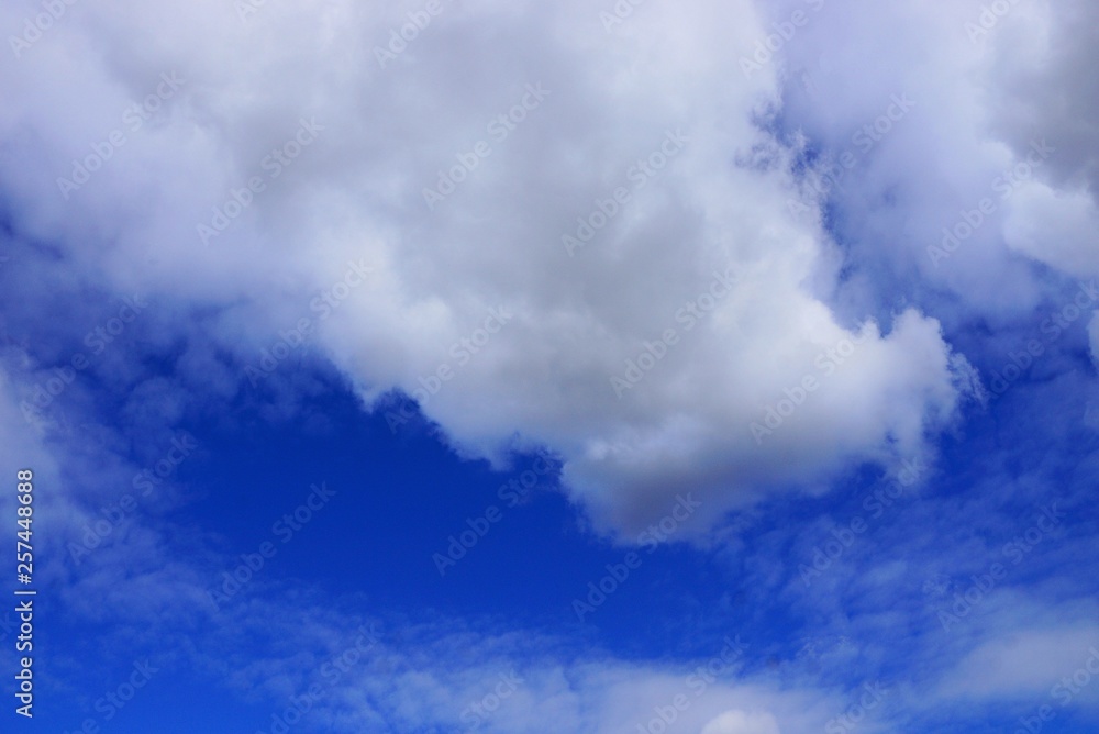 big beautiful white clouds on a blue daytime bright sky