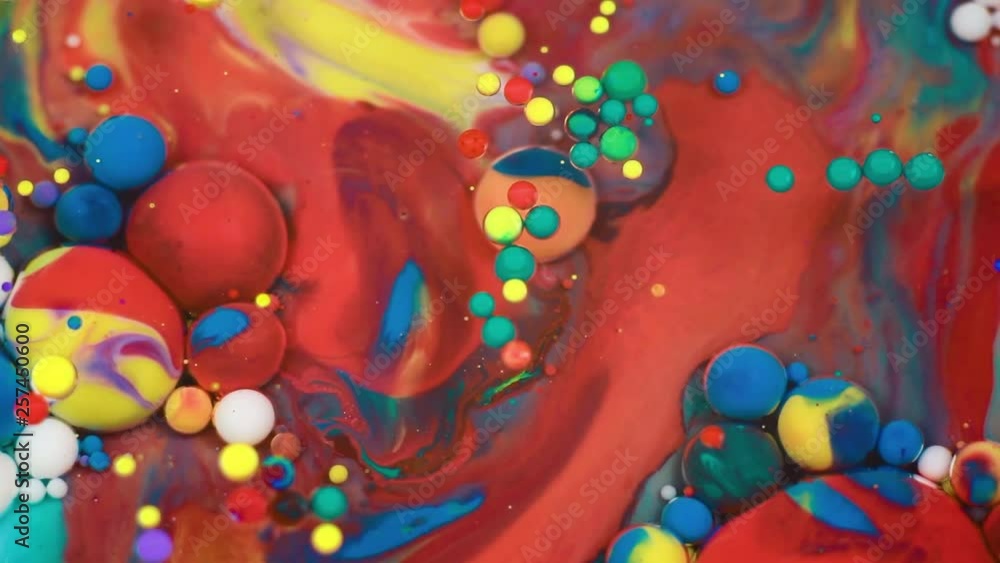 Abstract multicolored bubbles paint. Slow motion. Top view Abstract multicolored bubbles paint. Slow motion. Top view