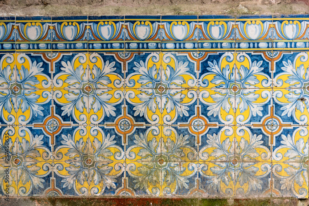 Tiles pattern of flowers with different colors like white, yellow and blue