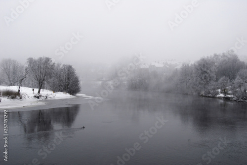 Foggy winter morning in Trondheim, Norway. The river Nidelva floats calmly through the city.