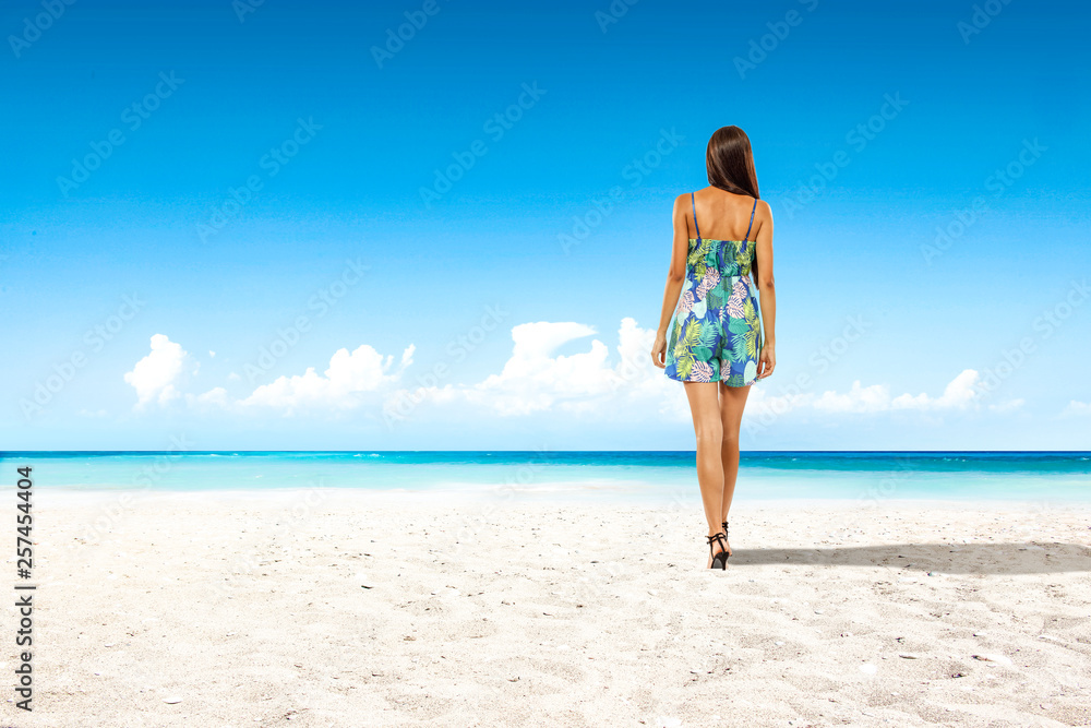 Slim young woman on beach and sea landscape Slim young woman on beach and sea landscape