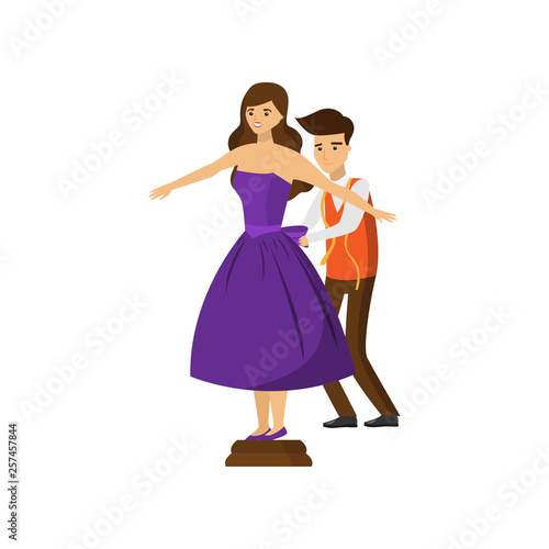 Male tailor and female customer trying on purple dress isolated on white background