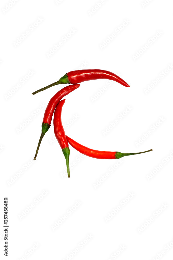Alphabet of hot spice cayenne chili peppers isolated on white. Vegetable chili peppers in shape of letter C, for making words and logo Alphabet of hot spice cayenne chili peppers isolated on white. Vegetable chili peppers in shape of letter C, for making words and logo