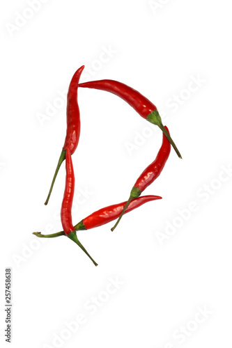 Alphabet of hot spice cayenne chili peppers isolated on white. Natural vegetarian diet organic vegetable chili peppers in shape of letter D, for making words and using as a logo