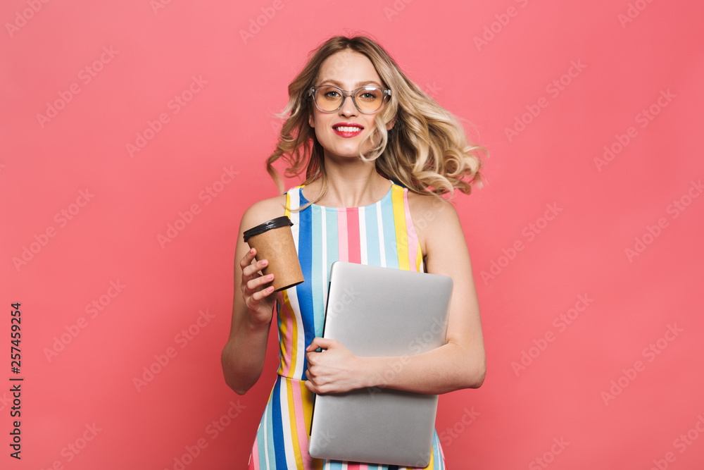 Cheerful young woman wearing eyeglasses standing Cheerful young woman wearing eyeglasses standing
