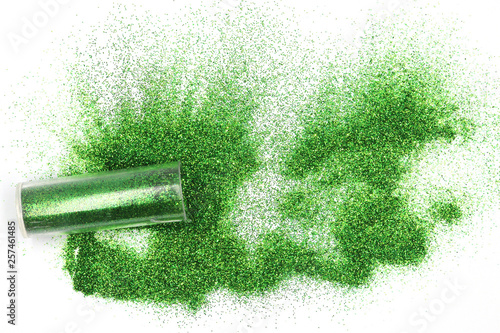 Jar with spilled green  glitter Magical, celestial green glitter spilling out of a jar isolated on white background