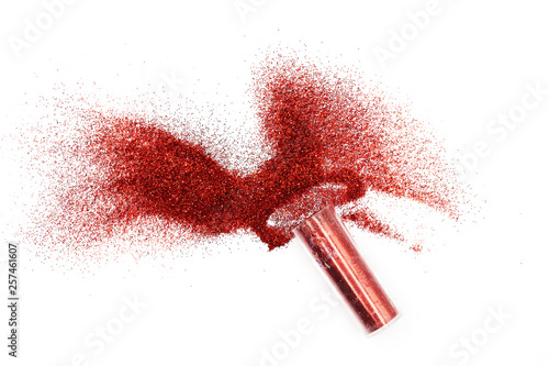 Jar with spilled red  glitter Magical, celestial red glitter spilling out of a jar isolated on white background