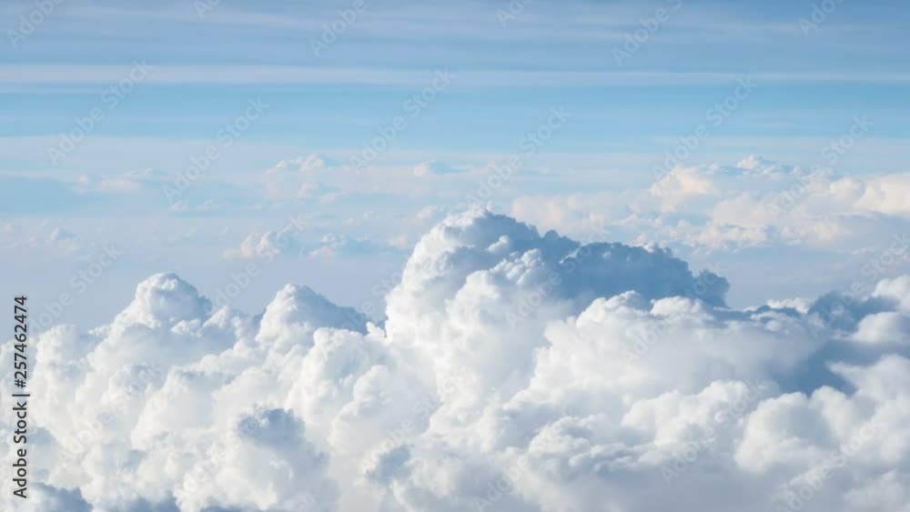 Clouds and sky view through window of aircraft Clouds and sky view through window of aircraft