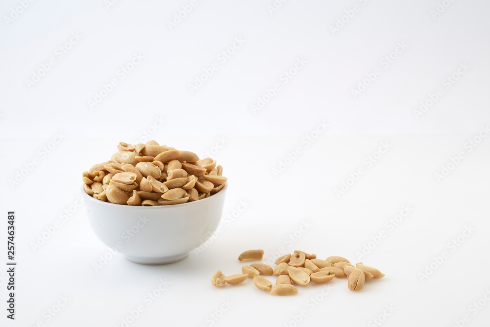 Roasted peanuts and salt in a bowl Roasted peanuts and salt in a bowl