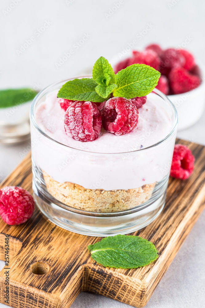 No baked cheesecake with raspberry in glass jar. No baked cheesecake with raspberry in glass jar.