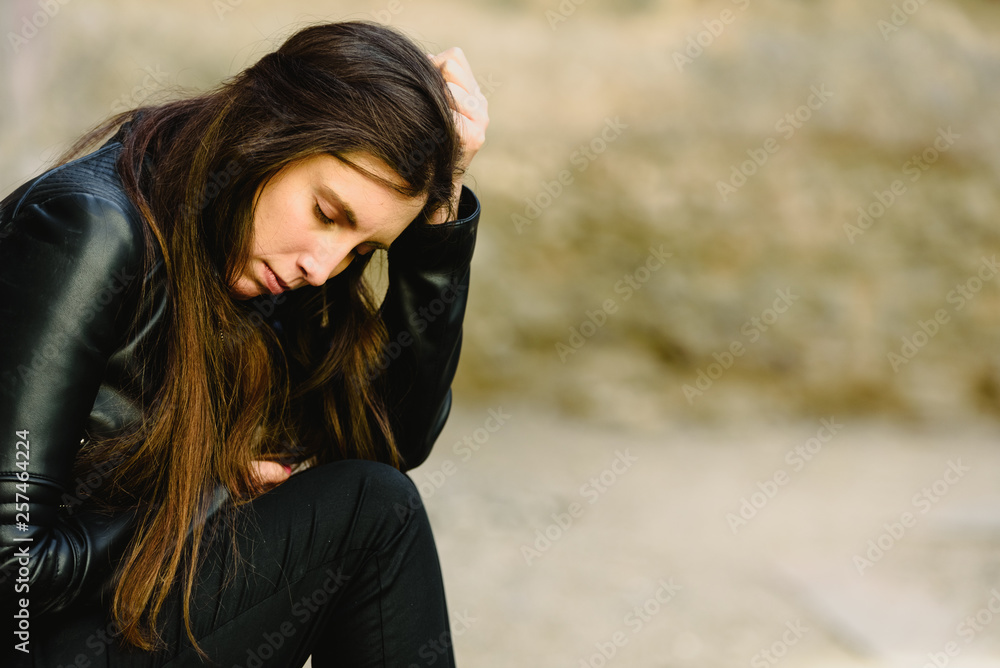 Portrait of young woman with worried expression, thoughtful about her future career. Portrait of young woman with worried expression, thoughtful about her future career.