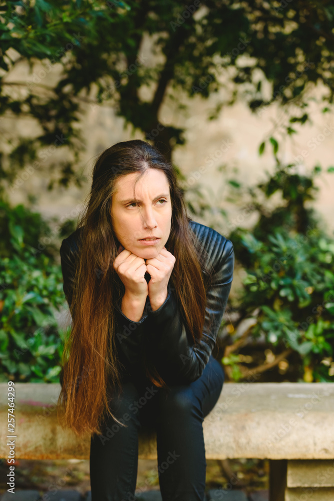 Serious and doubtful young woman with unsure face, feeling uncertain considering making decision, copy free space for text. Serious and doubtful young woman with unsure face, feeling uncertain considering making decision, copy free space for text.