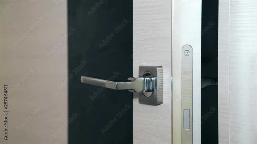 Opening wooden steel door with metal handle HD 1920x1080.Texture.Background. Opening wooden steel door with metal handle HD 1920x1080.Texture.Background.
