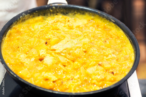 spanish omelette in skillet frying pan