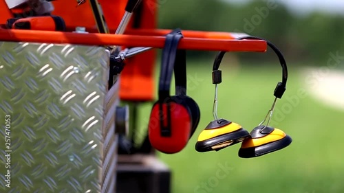 Noise Reduction Headphones on hammer machine. Industrial Theme