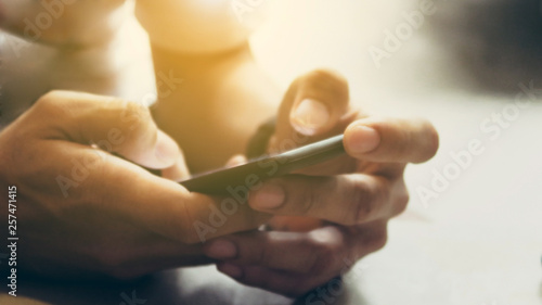 Closeup Image of man's hand holding a smartphone