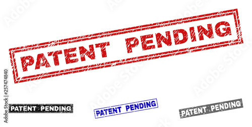 Grunge PATENT PENDING rectangle stamp seals isolated on a white background. Rectangular seals with grunge texture in red, blue, black and gray colors.