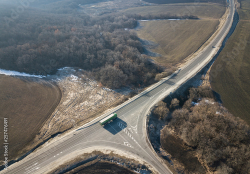 Aerial Top View of Truck with Cargo Semi Trailer Moving on Road in Direction