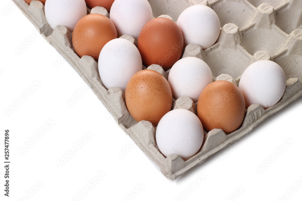Chicken eggs white and light brown.