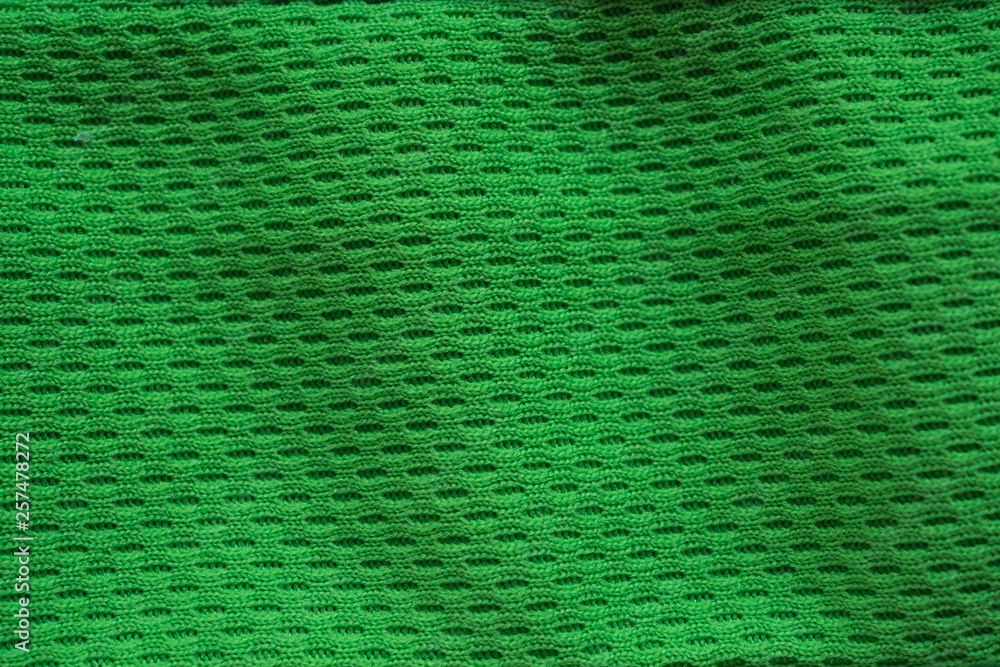 Green fabric sport clothing football jersey with air mesh texture  background Stock Photo | Adobe Stock
