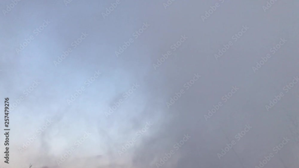 Smoke rises from the ground against the sky. Smoke from the fire. Against the backdrop of smoke. Smoke rises from the ground against the sky. Smoke from the fire. Against the backdrop of smoke.