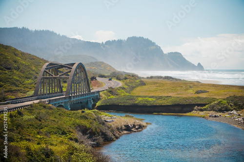 A bridge crosses over Big Creek along Route 101 that parallels the Oregon Coastline, USA. photo