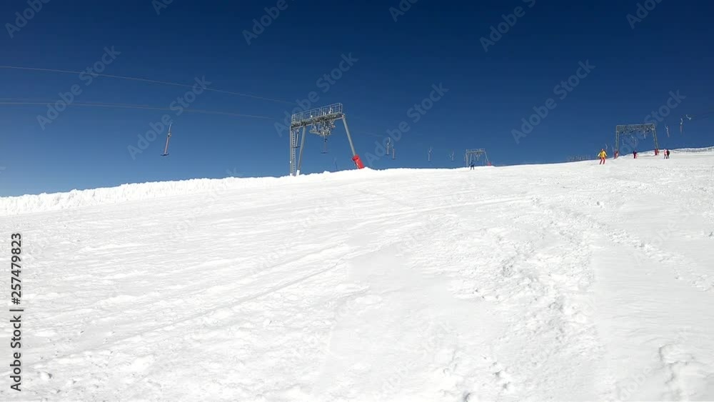 Professional Skier Skiing On Sunny Winter Day - Slow motion Professional Skier Skiing On Sunny Winter Day - Slow motion