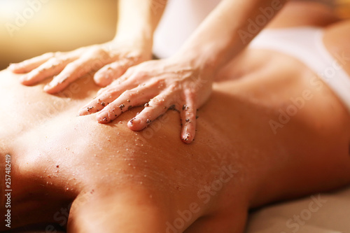 Obraz na plátně Happy woman having peeling in spa salon