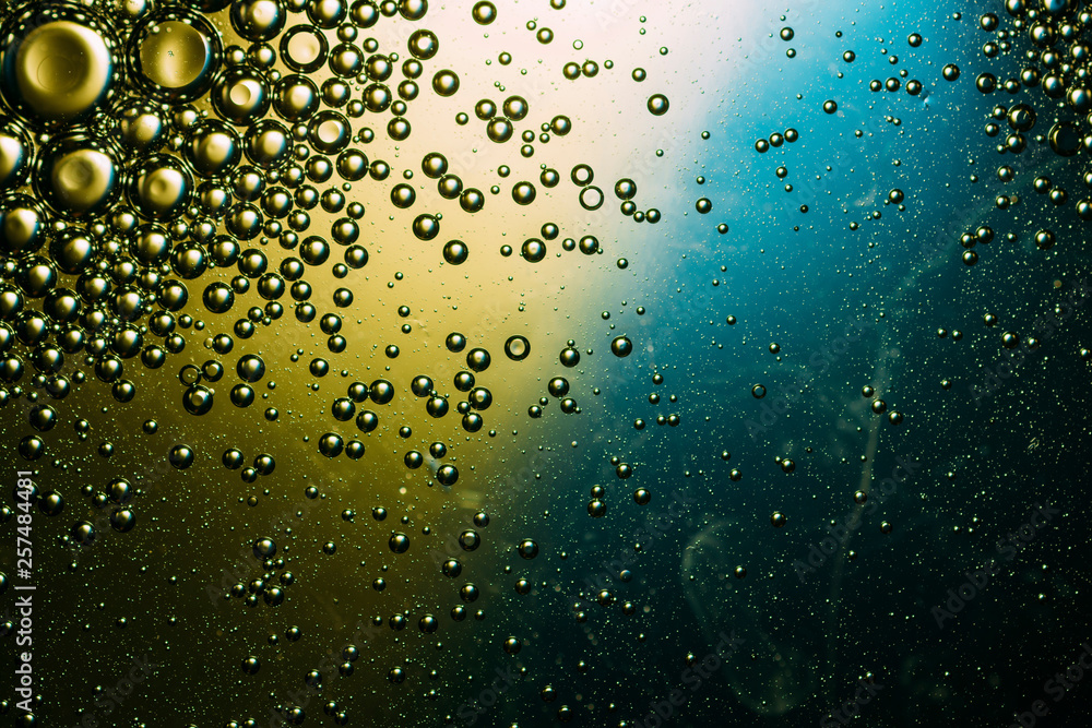 underwater abstract bubbles backdrop, air bubbles in water colorful blue and gold gradient background