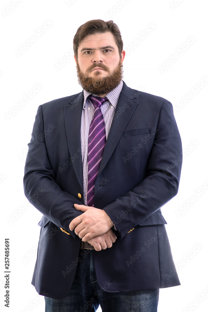Portrait of a big handsome serious bearded business man in a dark suit and a bright blue tie, isolated on white Portrait of a big handsome serious bearded business man in a dark suit and a bright blue tie, isolated on white
