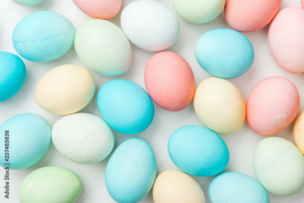 background with colorful pastel easter eggs isolated on white