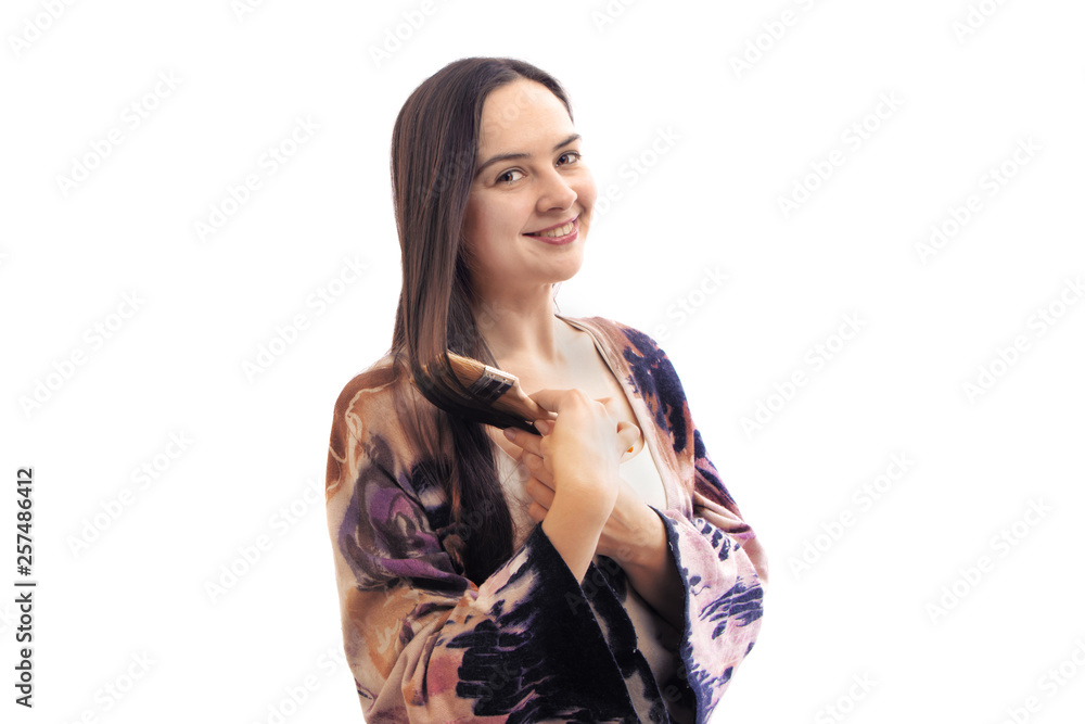 Portrait happy artist painter posing and smiling with brush in a studio. Creative painter girl, isolated on white Portrait happy artist painter posing and smiling with brush in a studio. Creative painter girl, isolated on white