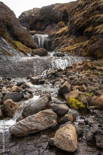 Cascade on the river with stones - Glymur, Iceland