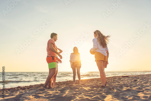 Group of friends enjoy on the beach