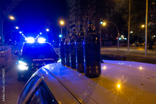 Картината върху платно Several liters of beer on top of a car that is under police control