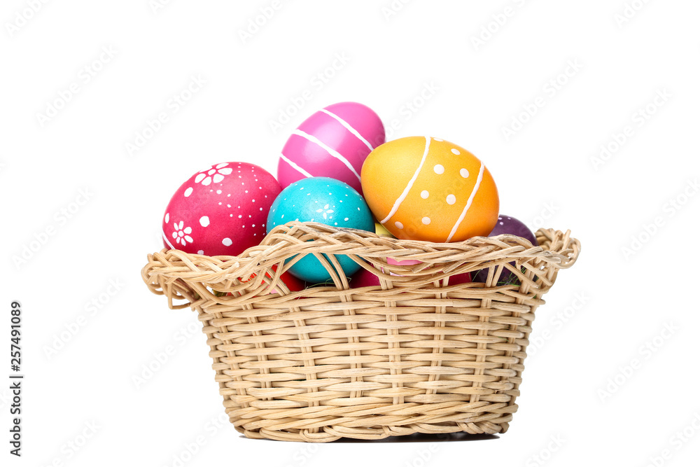 Easter eggs in basket isolated on white background Easter eggs in basket isolated on white background