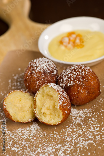 Donut holes with powdered sugar and Bavarian cream dip