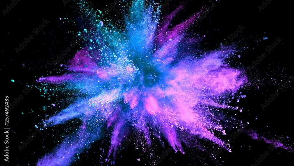 Super slowmotion shot of color powder explosion isolated on black background.