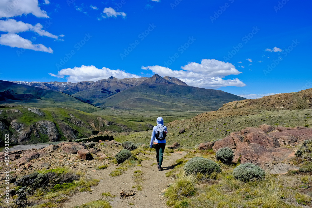 Hiker in scenery with mountains, El Chalten, Santa Cruz Province, Patagonia, Argentina Hiker in scenery with mountains, El Chalten, Santa Cruz Province, Patagonia, Argentina
