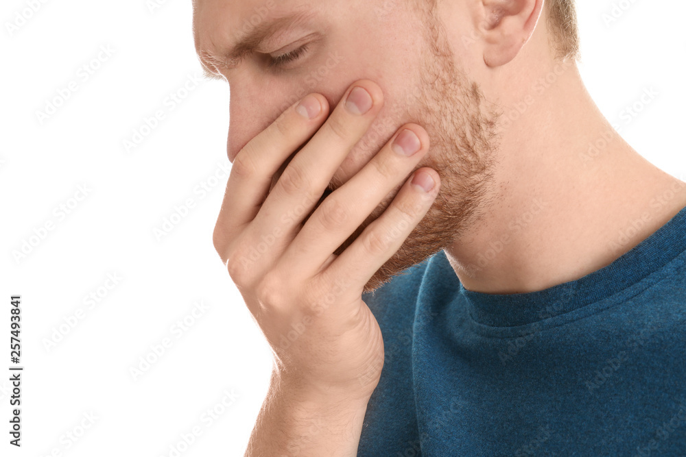 Handsome young man coughing against white background Handsome young man coughing against white background