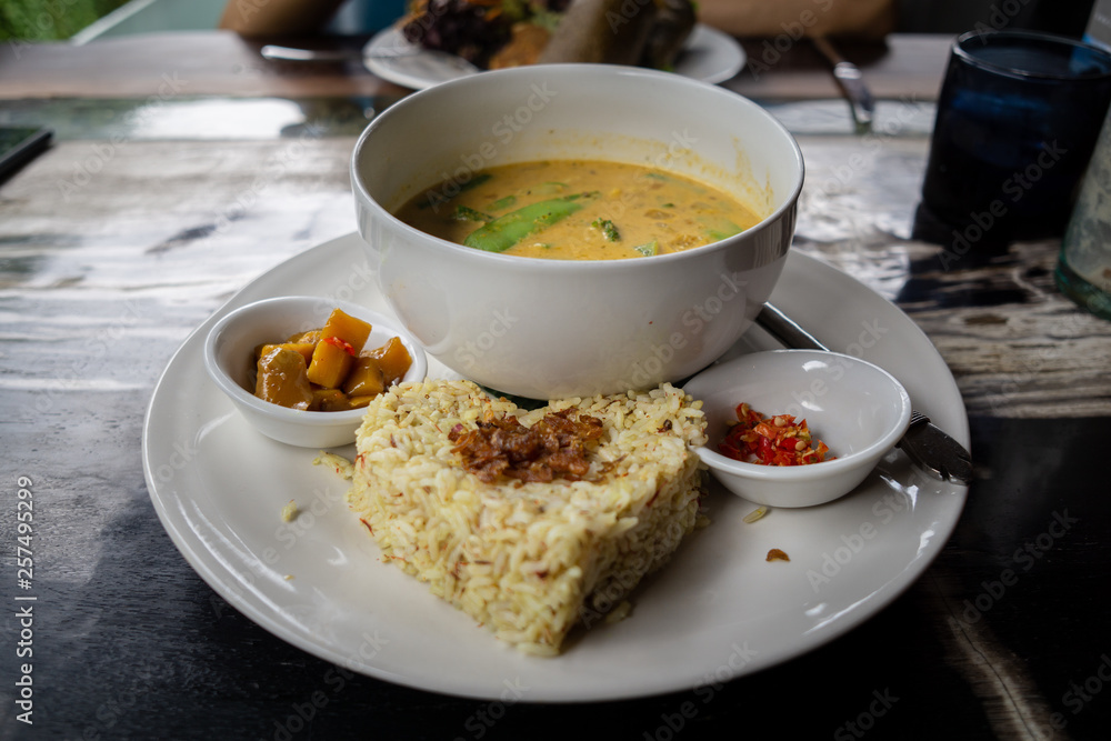 Delicious rice and a bowl of soup with spicy sauce make this lunch very tasty and delicious. It is organic and healthy too Delicious rice and a bowl of soup with spicy sauce make this lunch very tasty and delicious. It is organic and healthy too