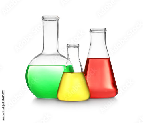 Laboratory glassware with different samples on white background. Solution chemistry