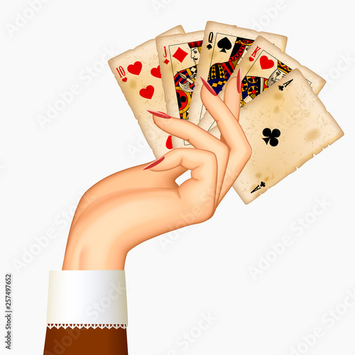 Female hand holding playing cards in retro style