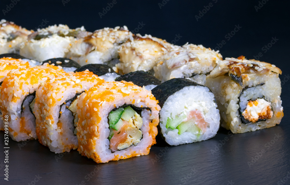 sushi set rolls with salmon eel cheese cucumber rice sauce sesame caviar sushi set rolls with salmon eel cheese cucumber rice sauce sesame caviar