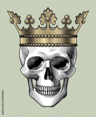 Human skull full face with a gold crown