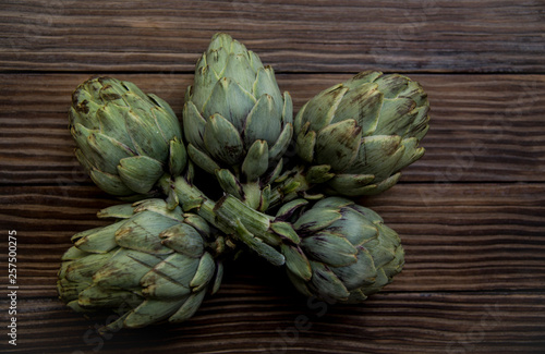 artichokes on old wooden table