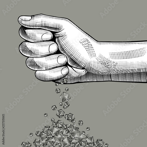 Hand pouring diamonds in a pile