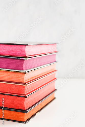 Pile of books with color stack on white background. Copy space