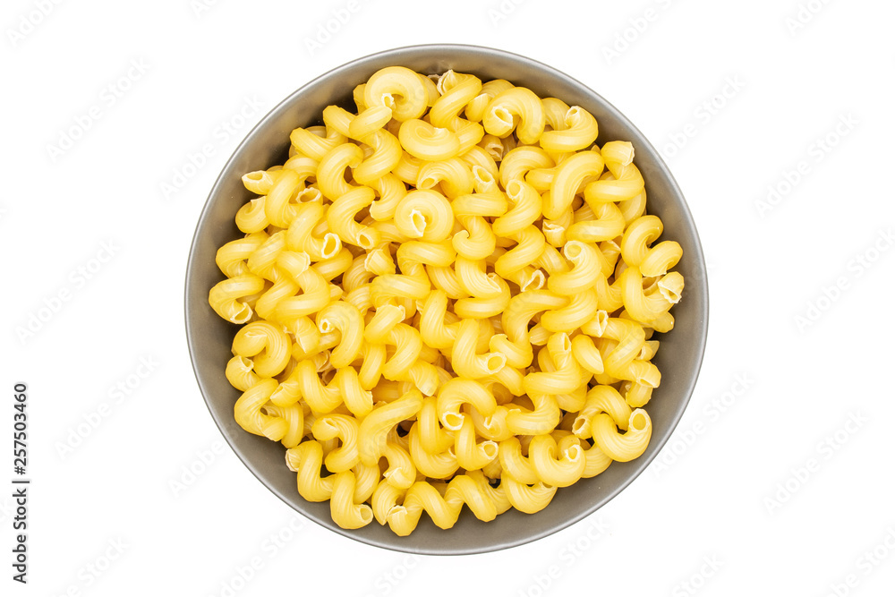 Lot of whole pasta cavatappi in a grey ceramic bowl flatlay isolated on white background Lot of whole pasta cavatappi in a grey ceramic bowl flatlay isolated on white background