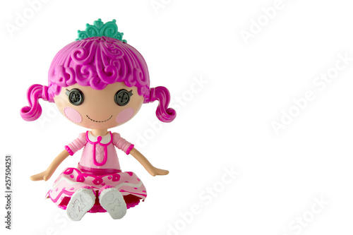 Beautiful doll with pink hair isolated on white background. Girl doll toy isolated.